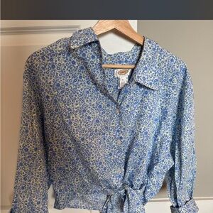 Thrifted blue and white floral button-up shirt with a tie waist.